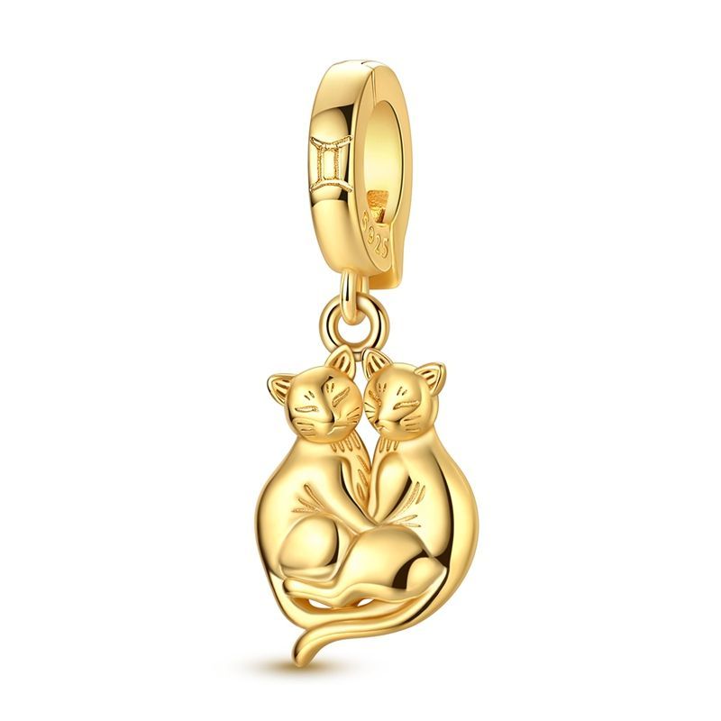 Géminis clip oro