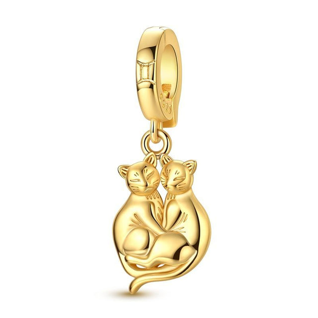 Géminis clip oro